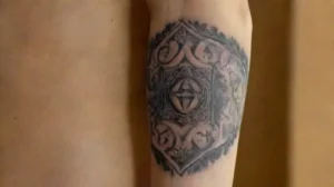 Detailed tattoo on realistic forearm skin