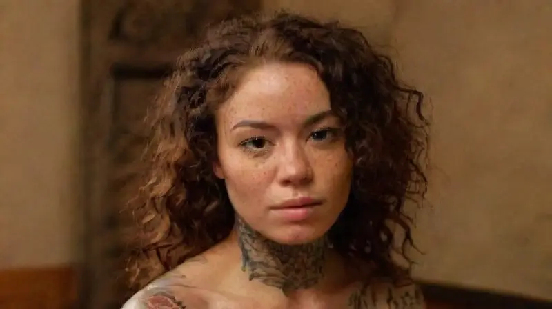 Diverse tattooed group sharing in studio warmth